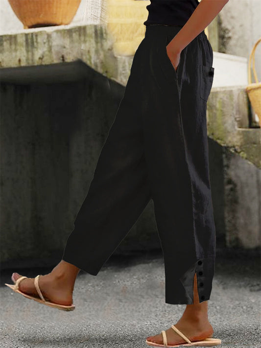 Loose fit buttoned minimalist trousers for women | Solene
